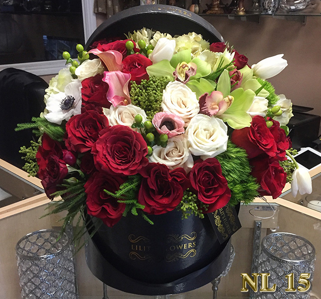 sympathy cross with white carnations and red roses